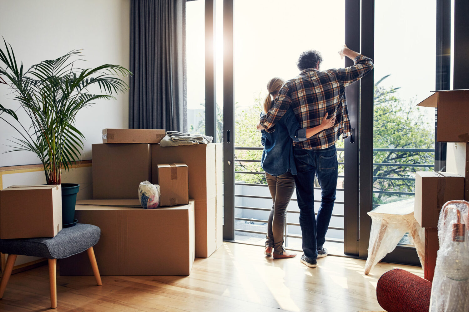 William Russell blog - guide to moving abroad in 2021 - couple looking out of new balcony